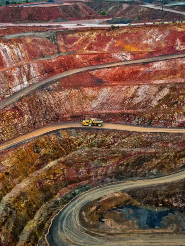 Mining Truck Makes Way Up Road Out Of Open Pit Mine