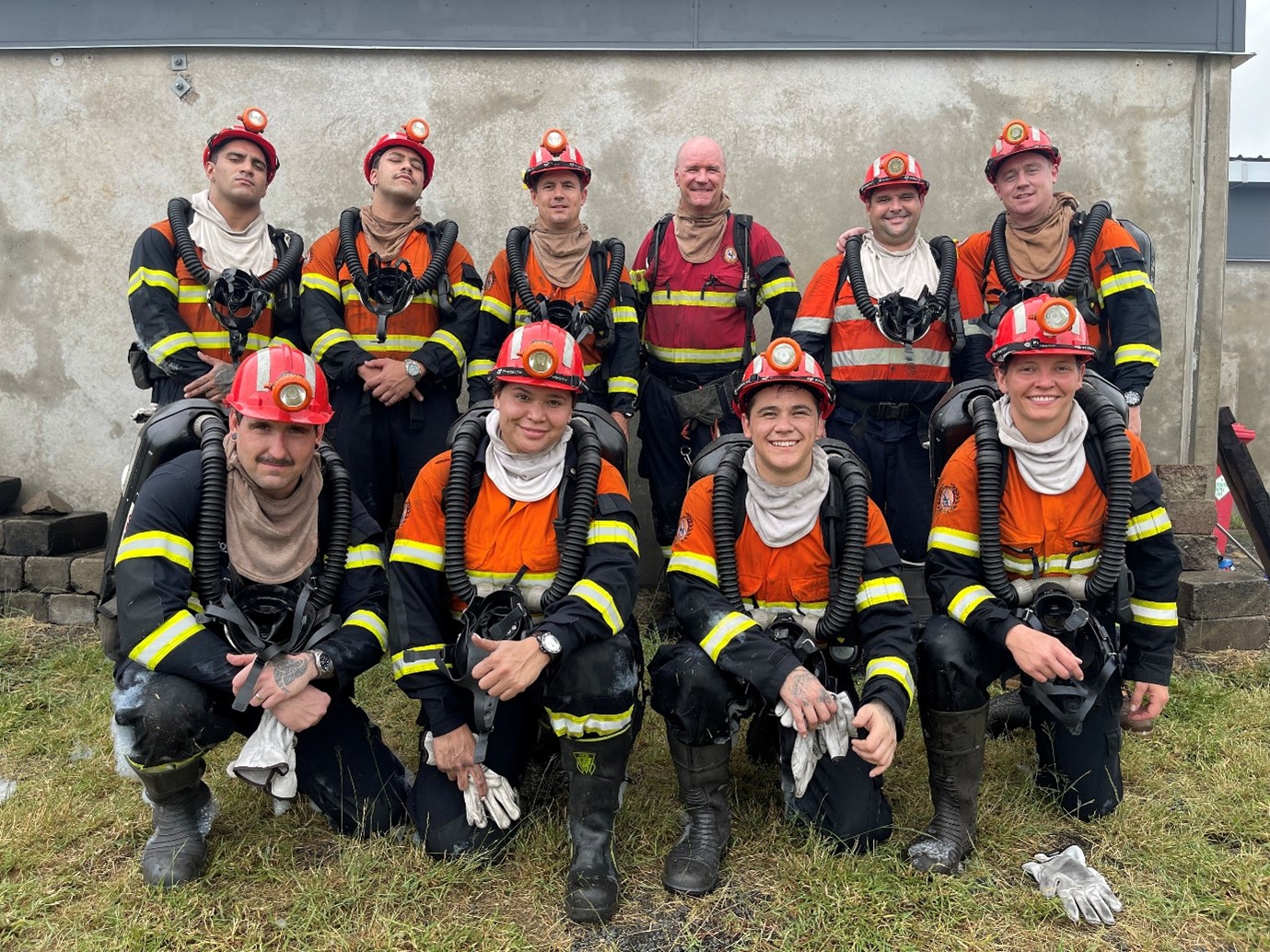 a group of QRMS staff in mine PPE